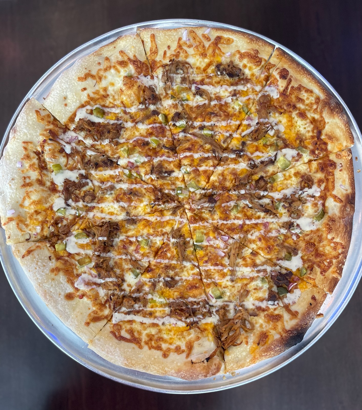 a pizza sitting on top of a pan on a table