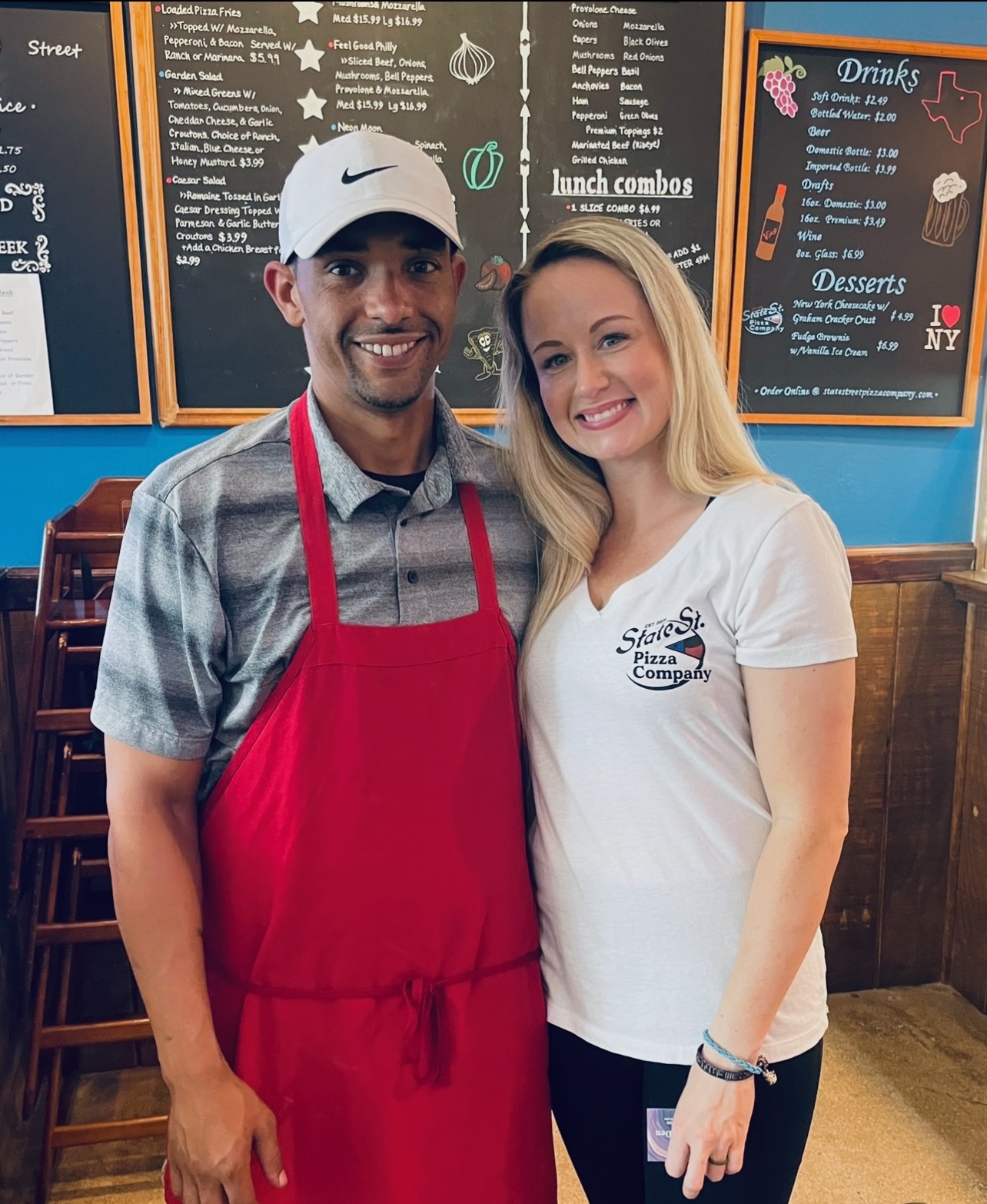 a man holding a sign posing for the camera