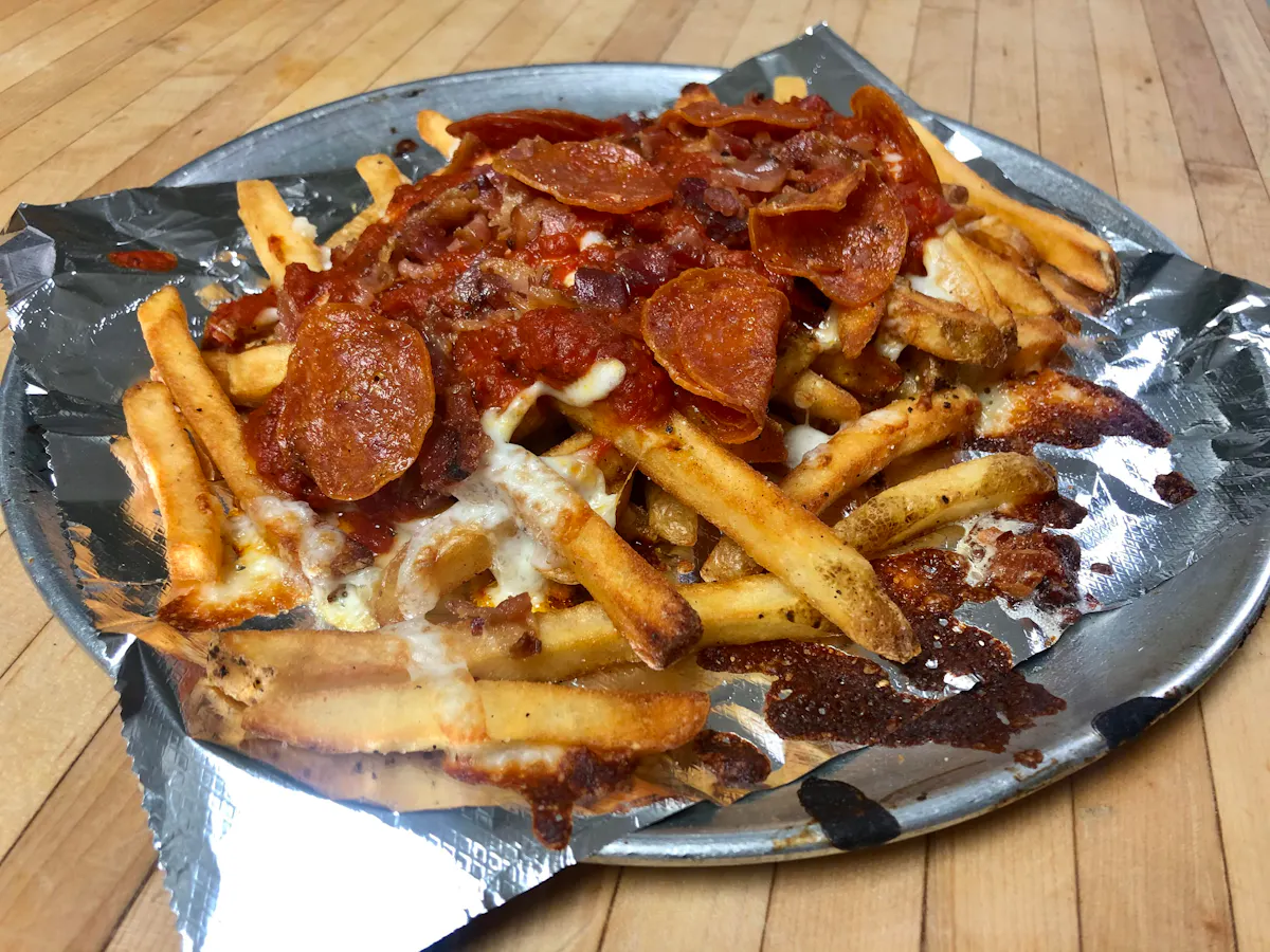 a plate of food sitting on top of a wooden table