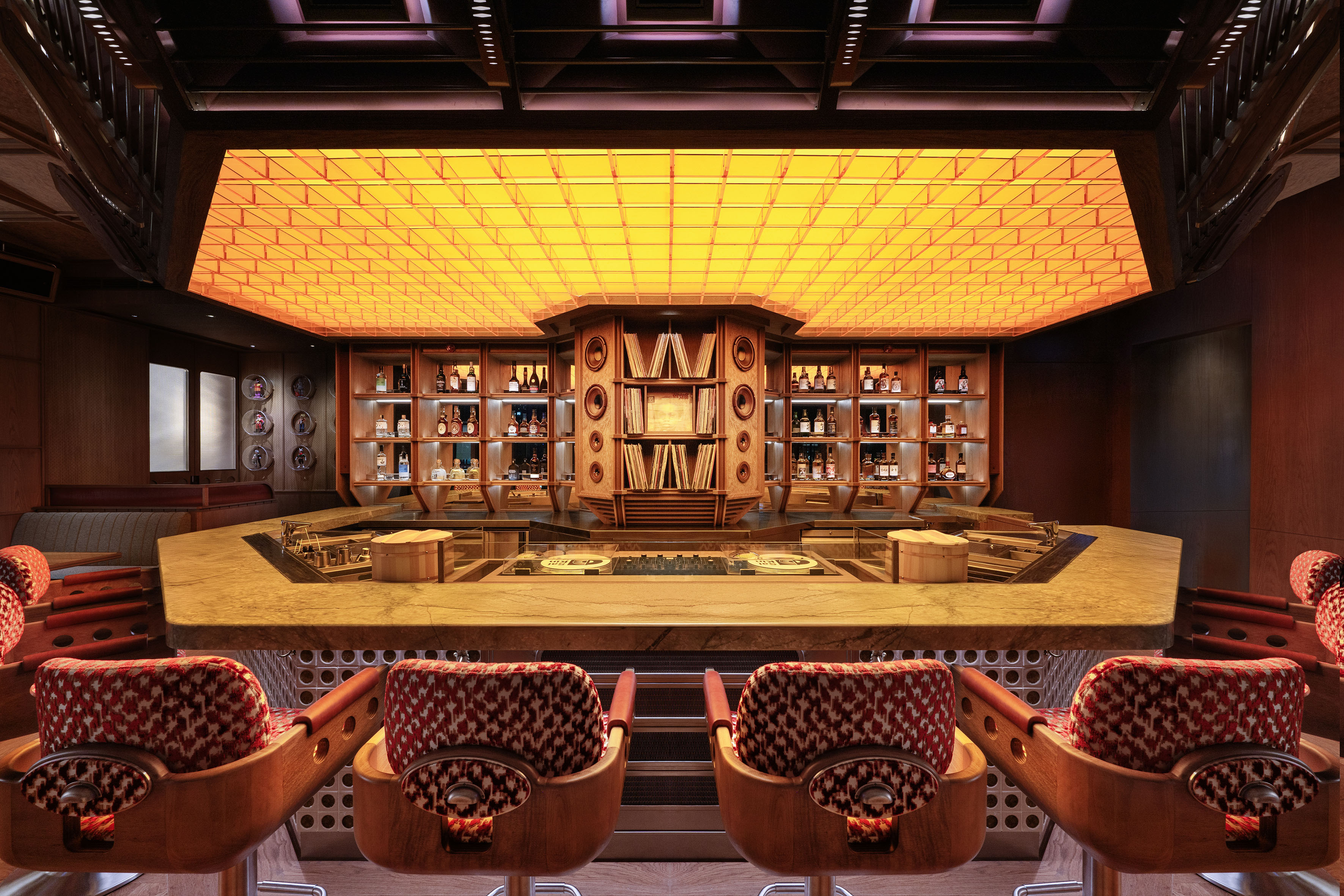 a bar with a counter and chairs