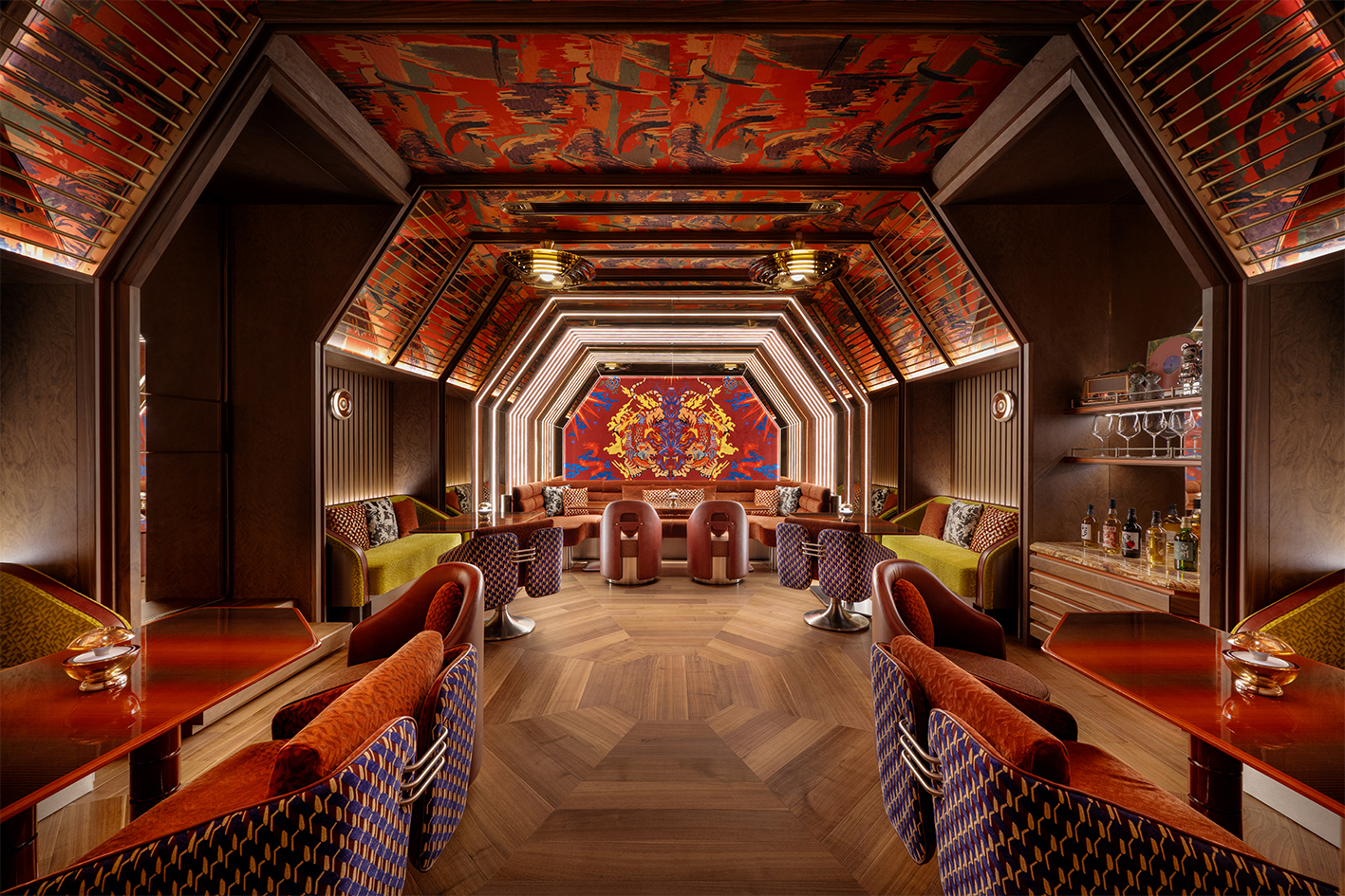 a room with colorful chairs and a wall