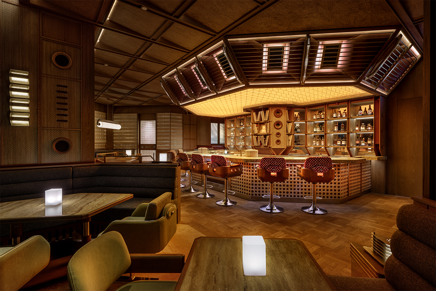 a room with a bar and chairs