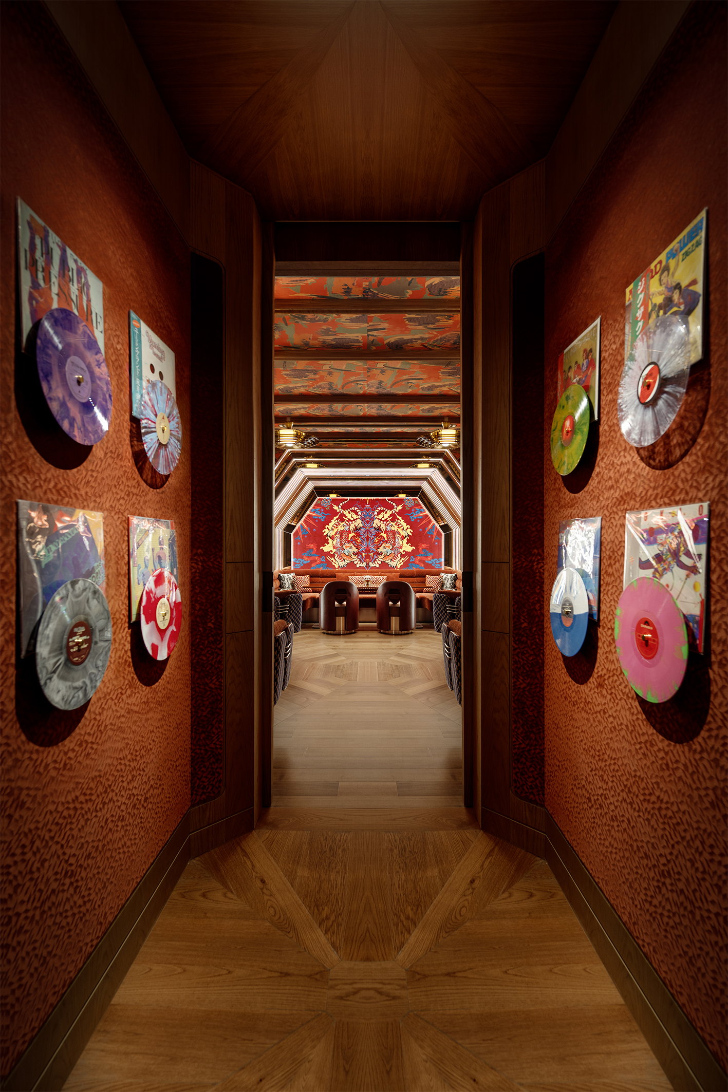 a hallway with a room with vinyl records on the wall