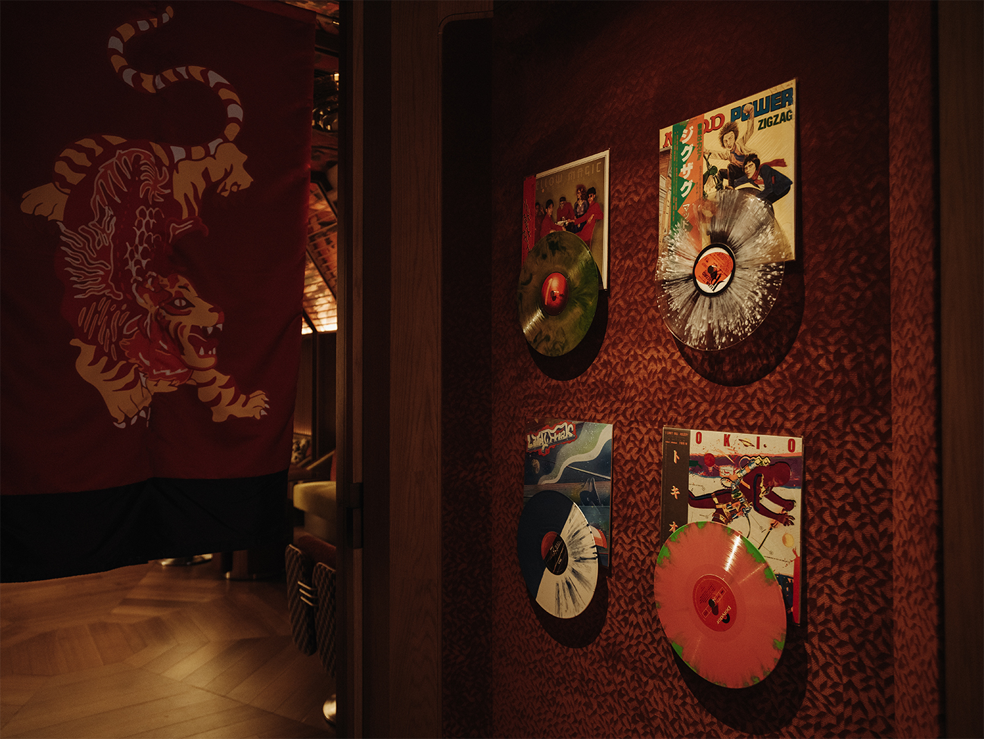 a wall with vinyl records on it