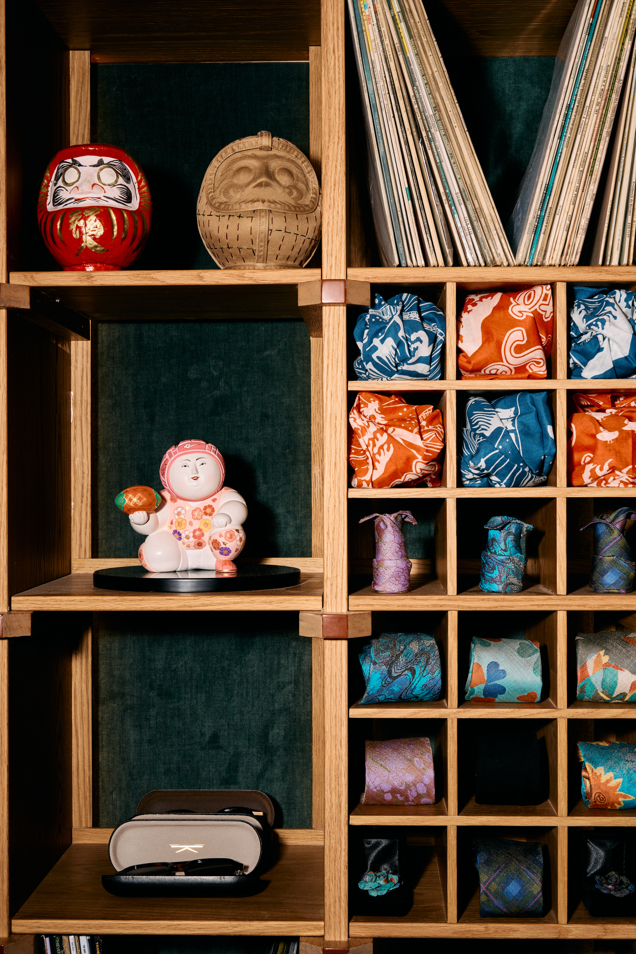 a shelf with colorful fabric and objects