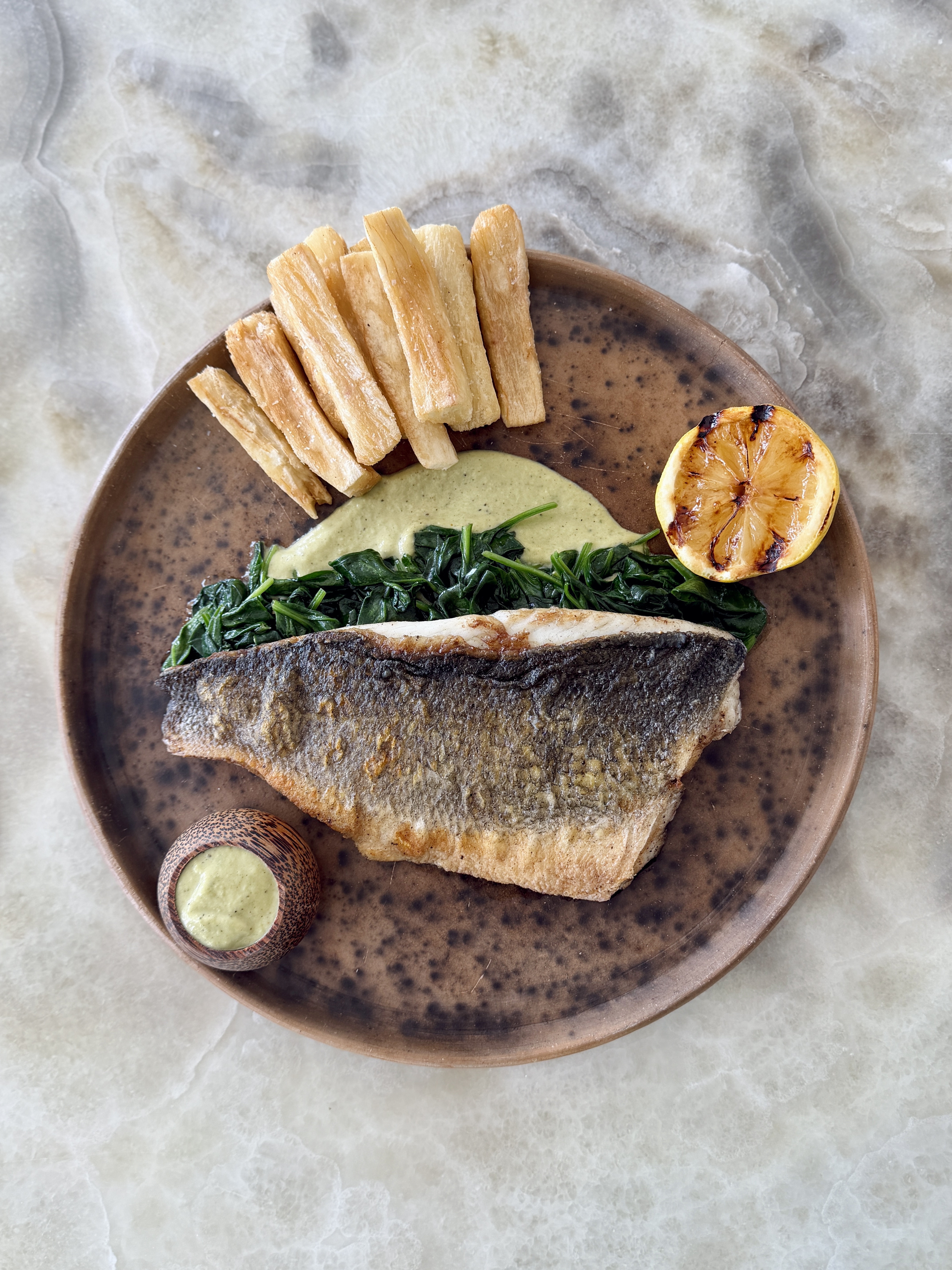a plate of food on a marble surface