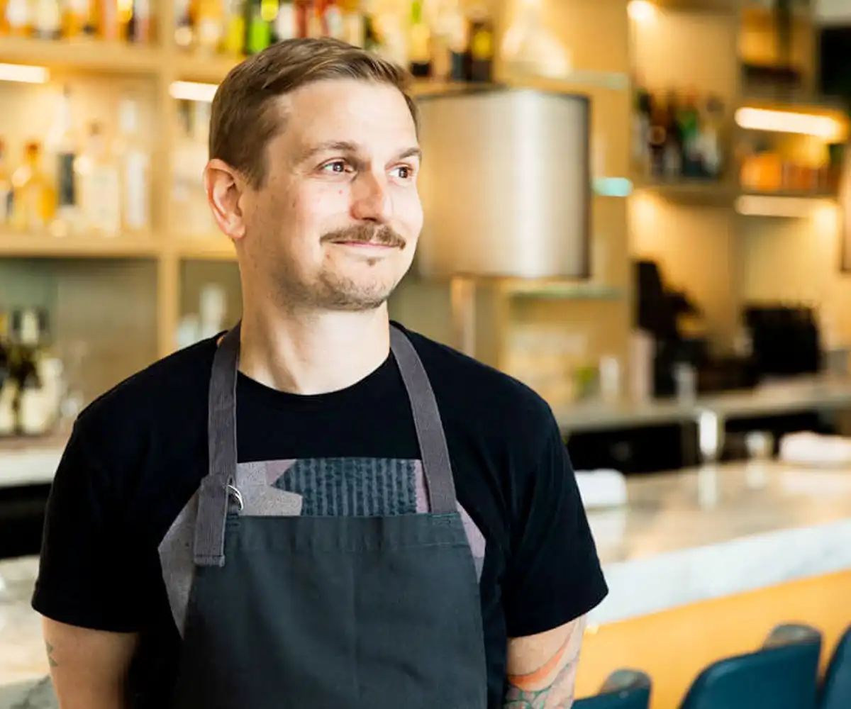 an executive chef wearing an apron