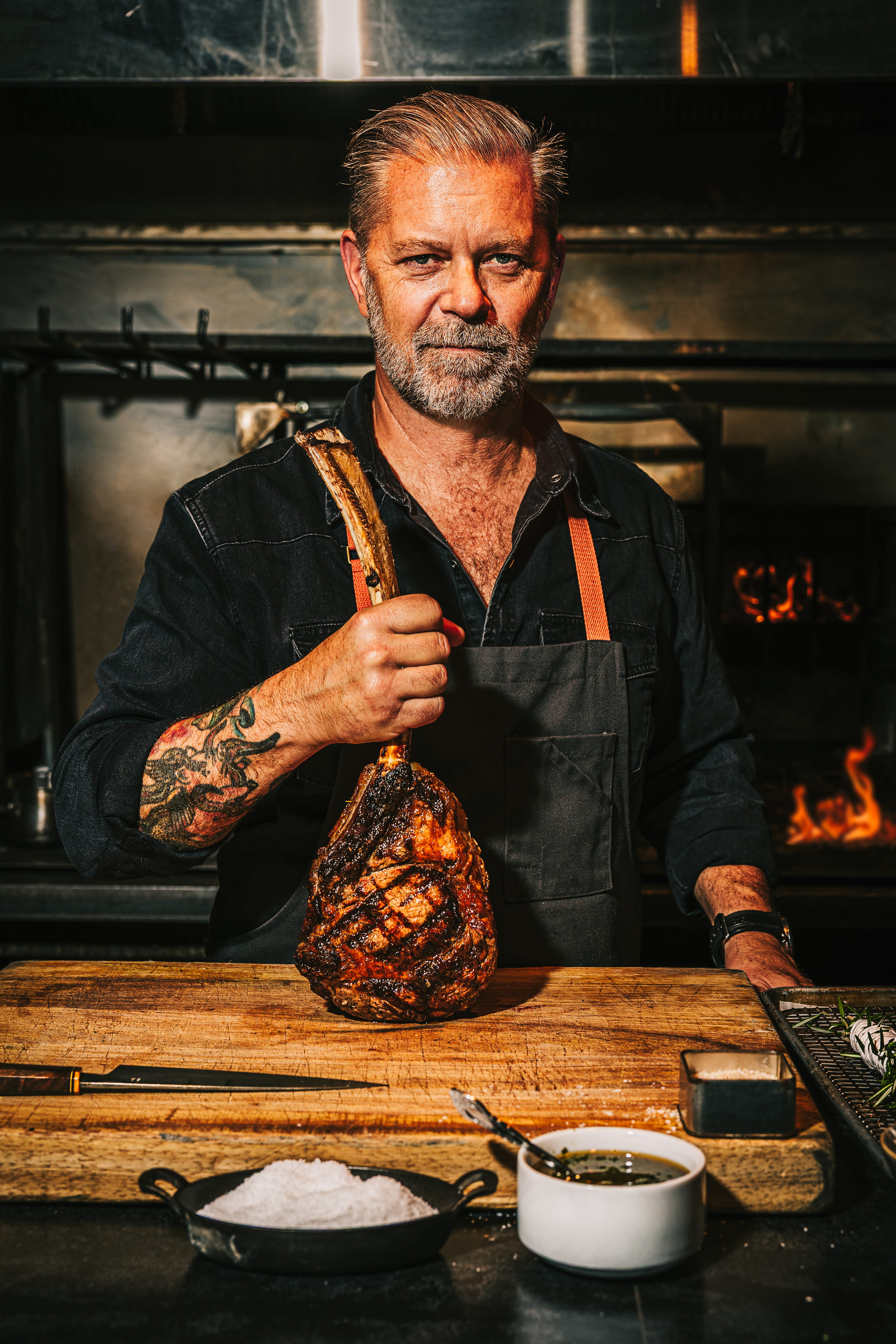 a man holding a piece of meat