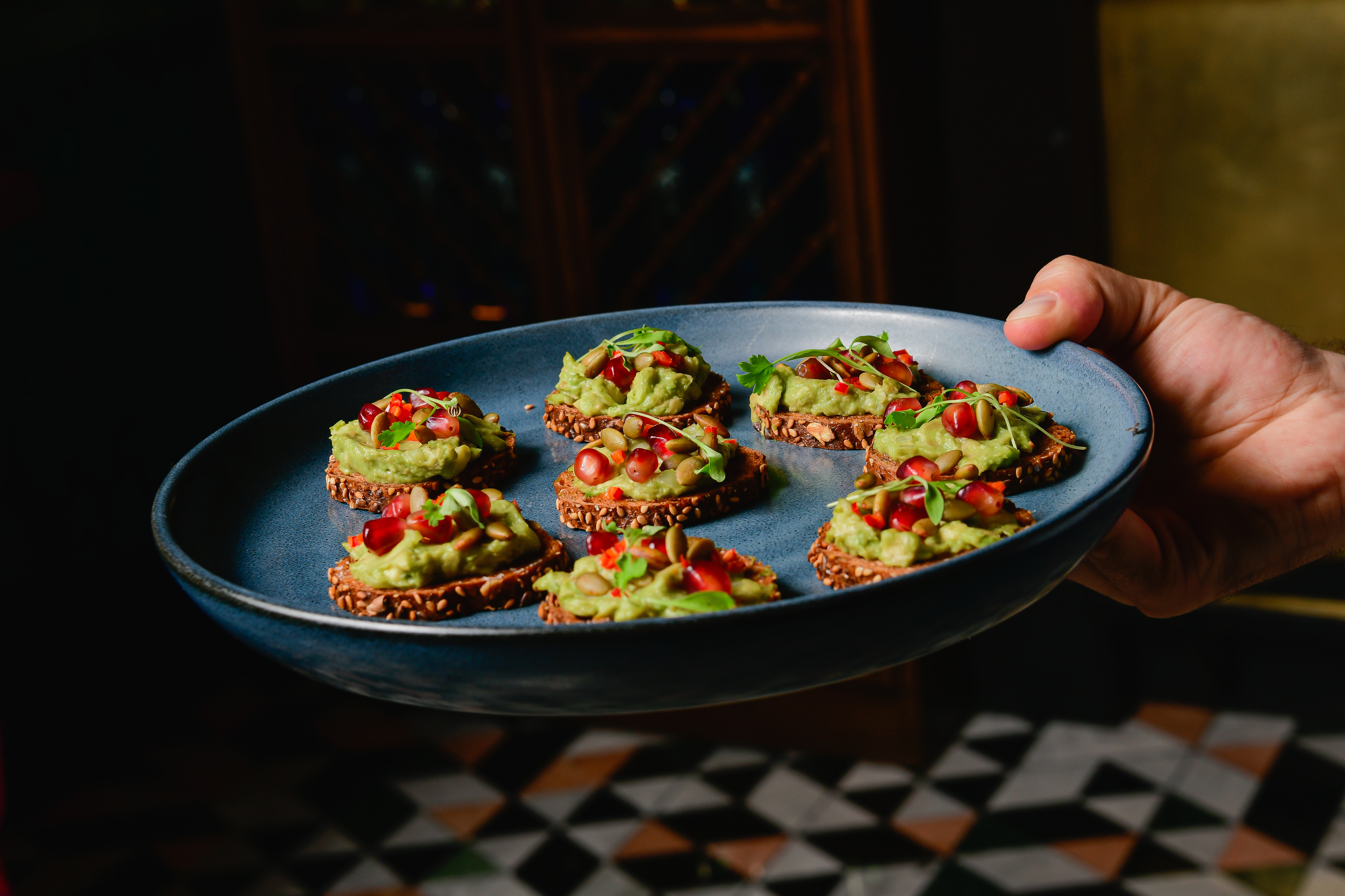 a person holding a bowl of food