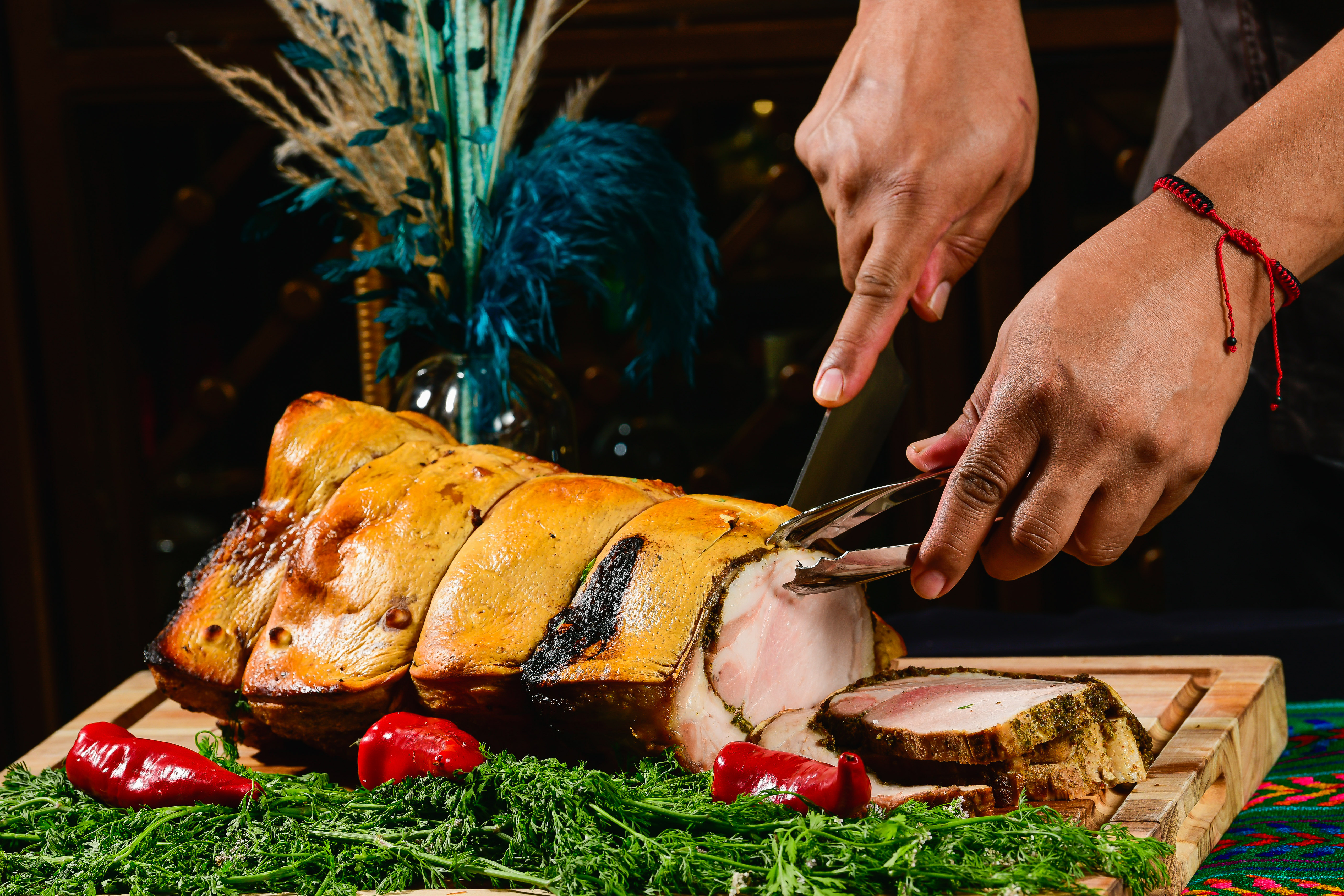 a person cutting food on a table