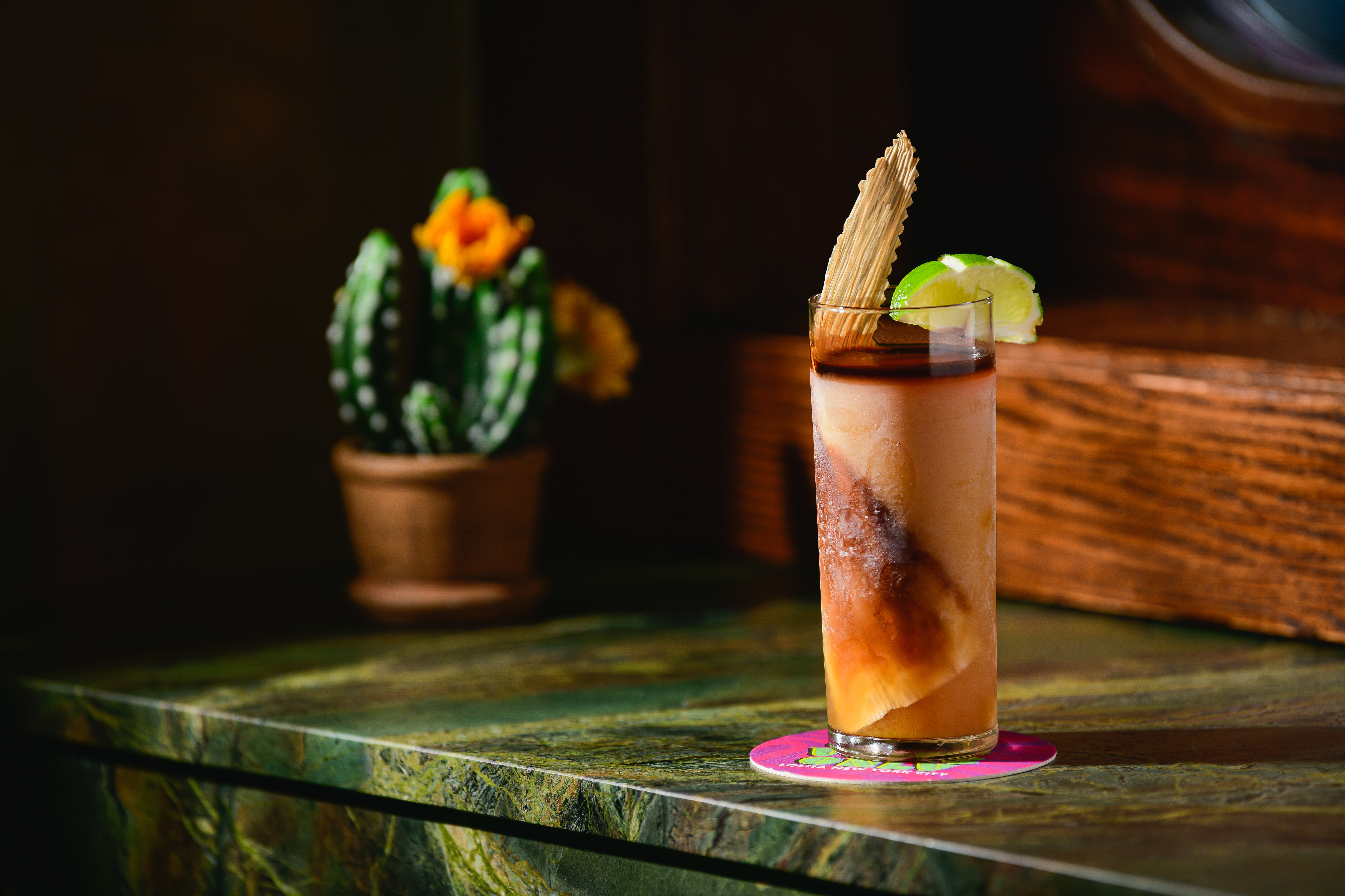 a vase sitting on top of a wooden table