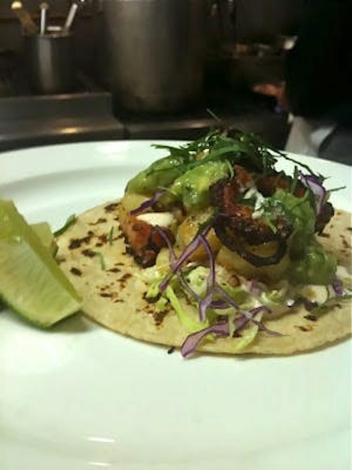 a plate of taco with toppings