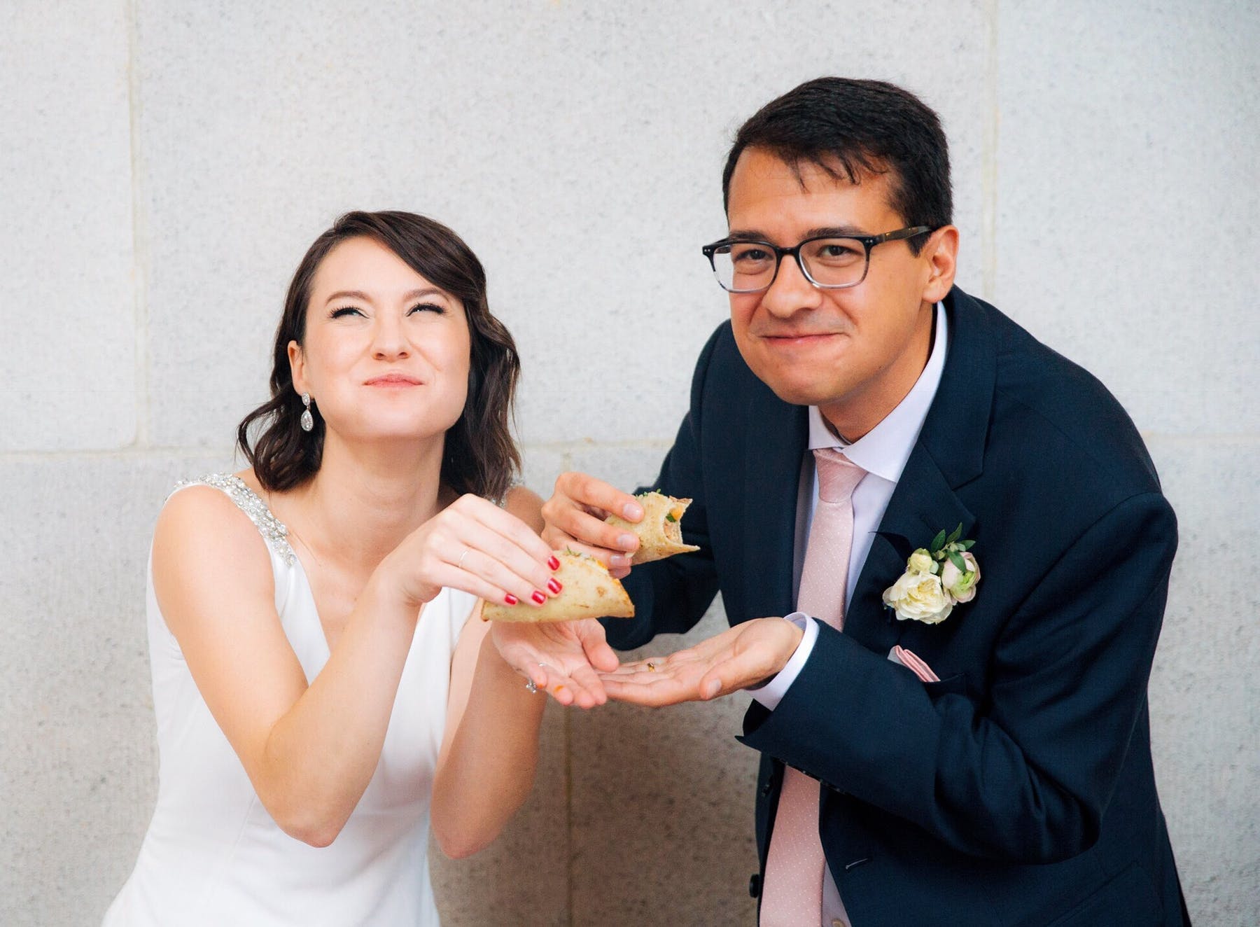 a man and a woman eating a sandwich