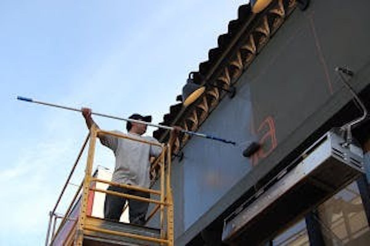 a man painting a wall