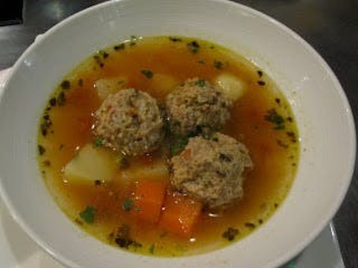 a plate of meatballs soup