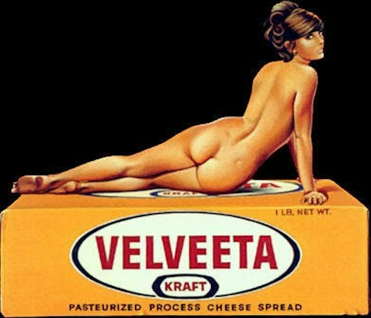 a woman posing over a kraft box