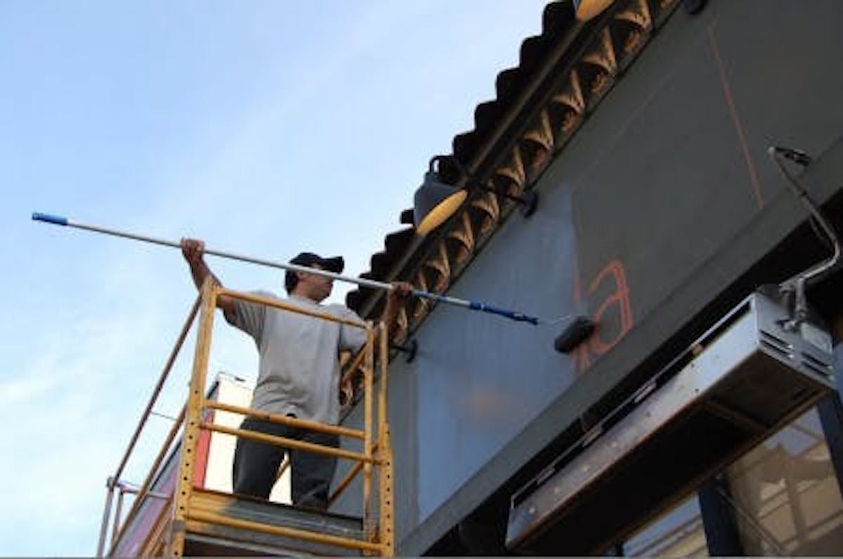 a man painting a wall