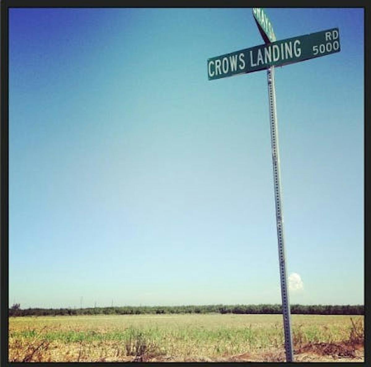 a field with a sign that reads 