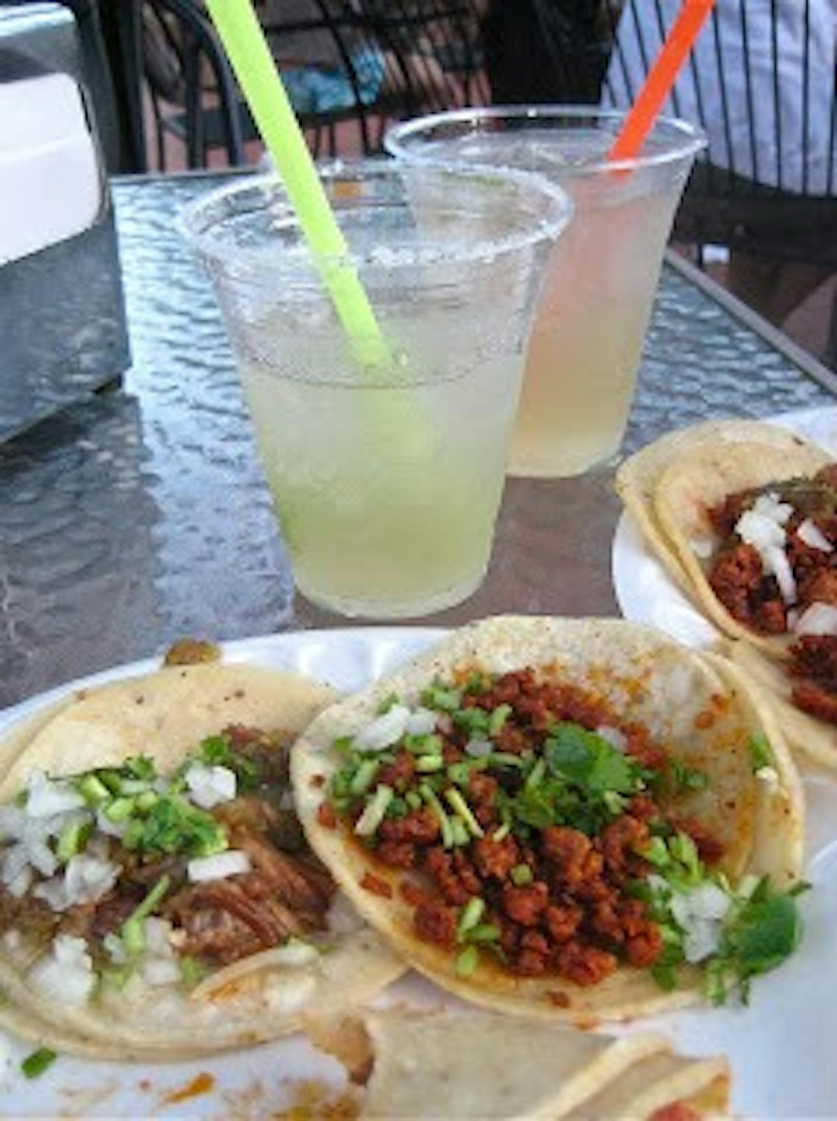 a plate of tacos and lemonade