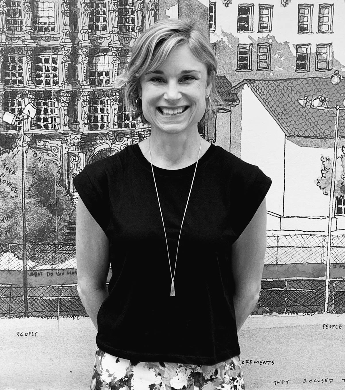 A photo of a woman smiling at the camera