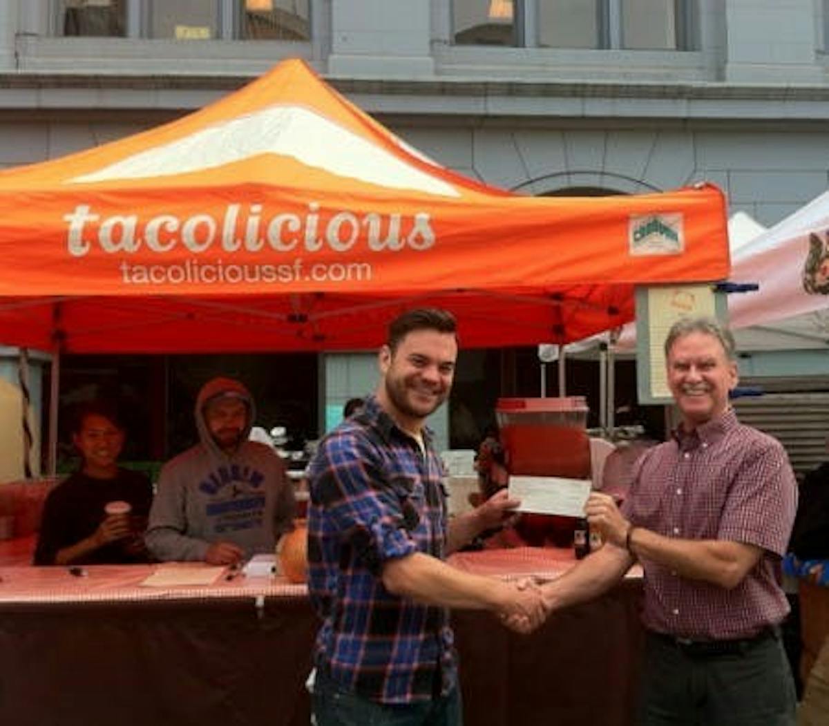 Kory hands off the check to CUESA executive director Dave Stockdale