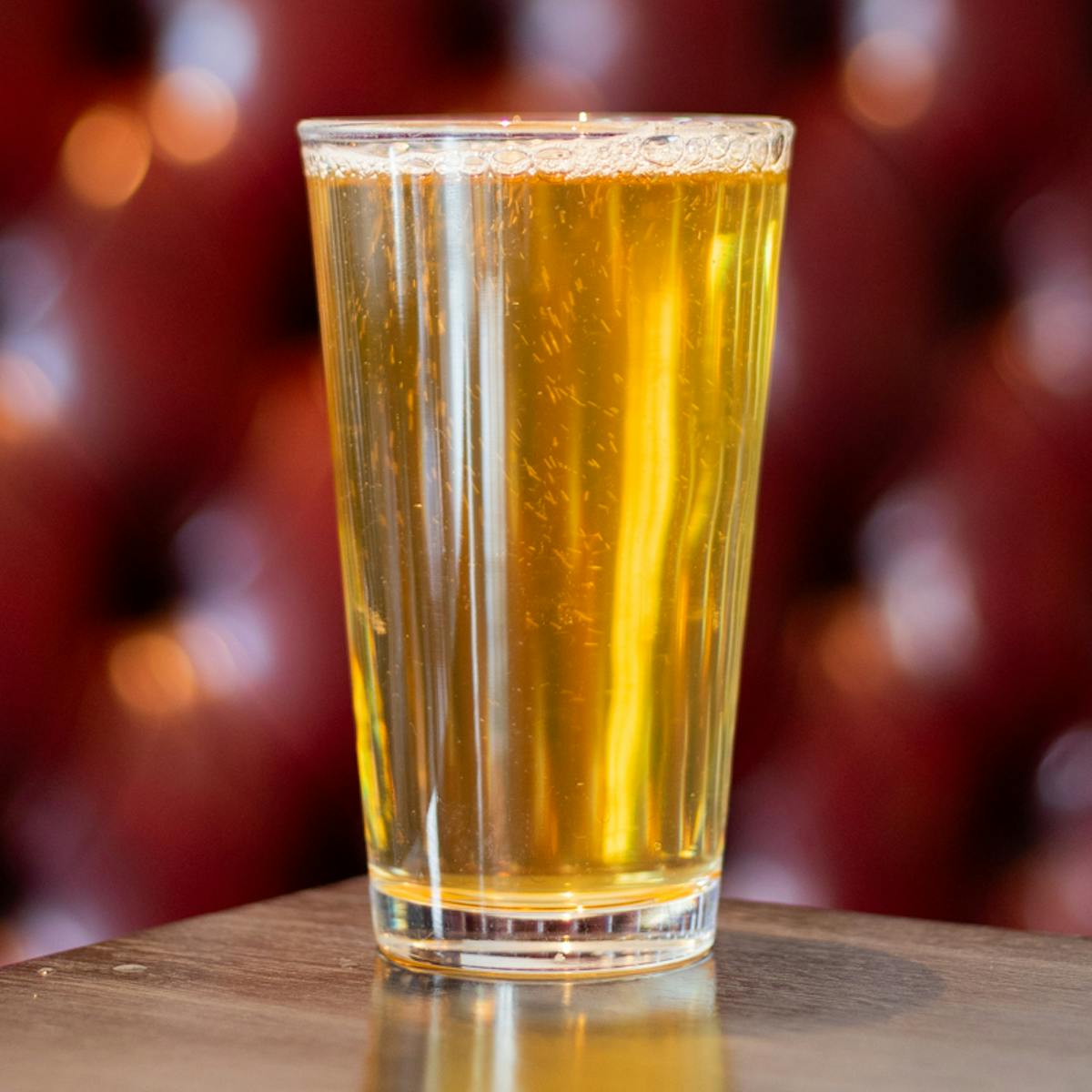 a glass of beer on a table