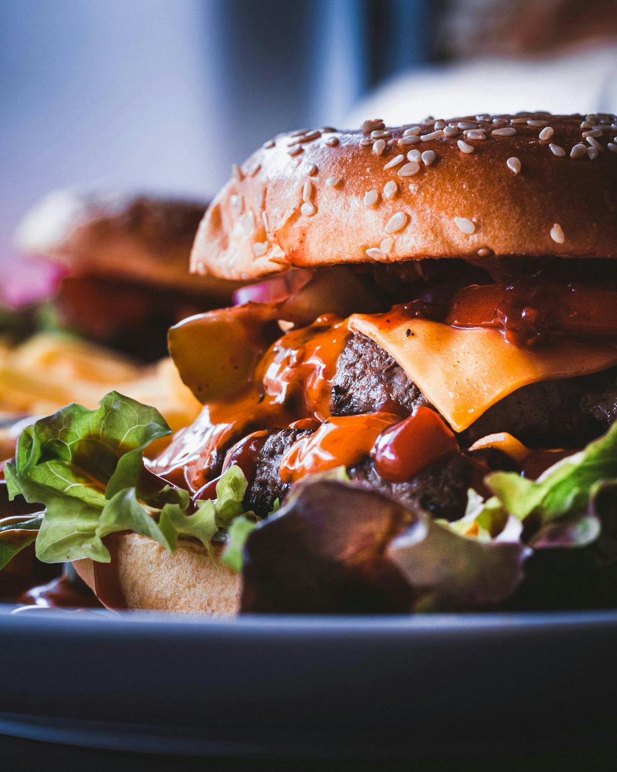 a close up of a plate of food with a sandwich and a salad