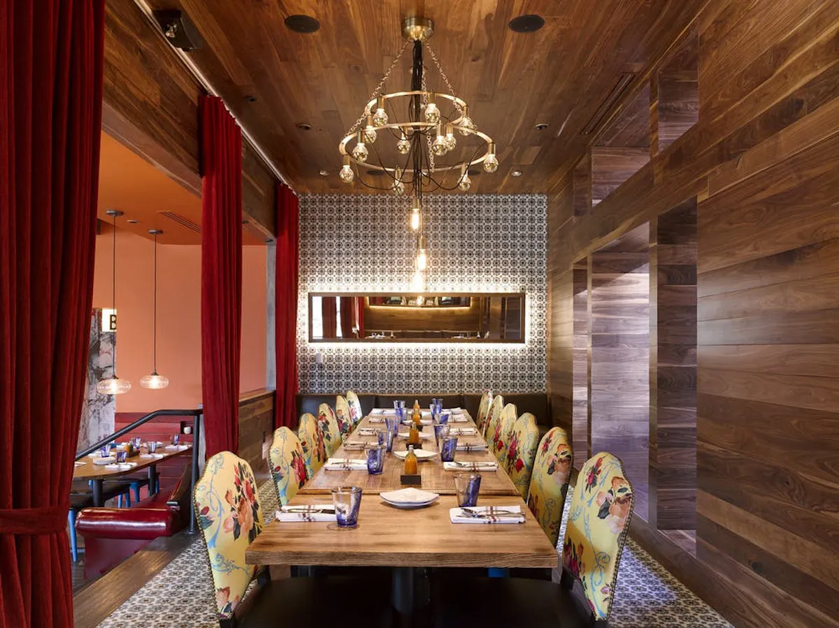 a room filled with furniture and vase on a table