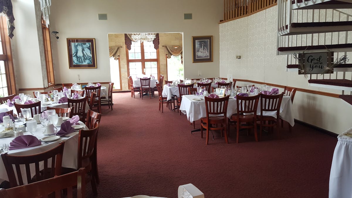 a living room filled with furniture and a table