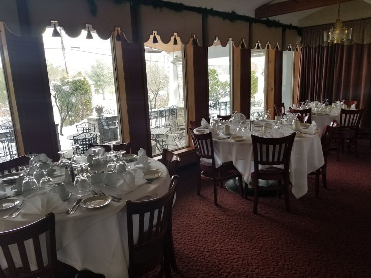 a dining room table in front of a window