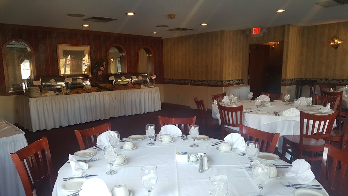 a dining table filled with wine glasses