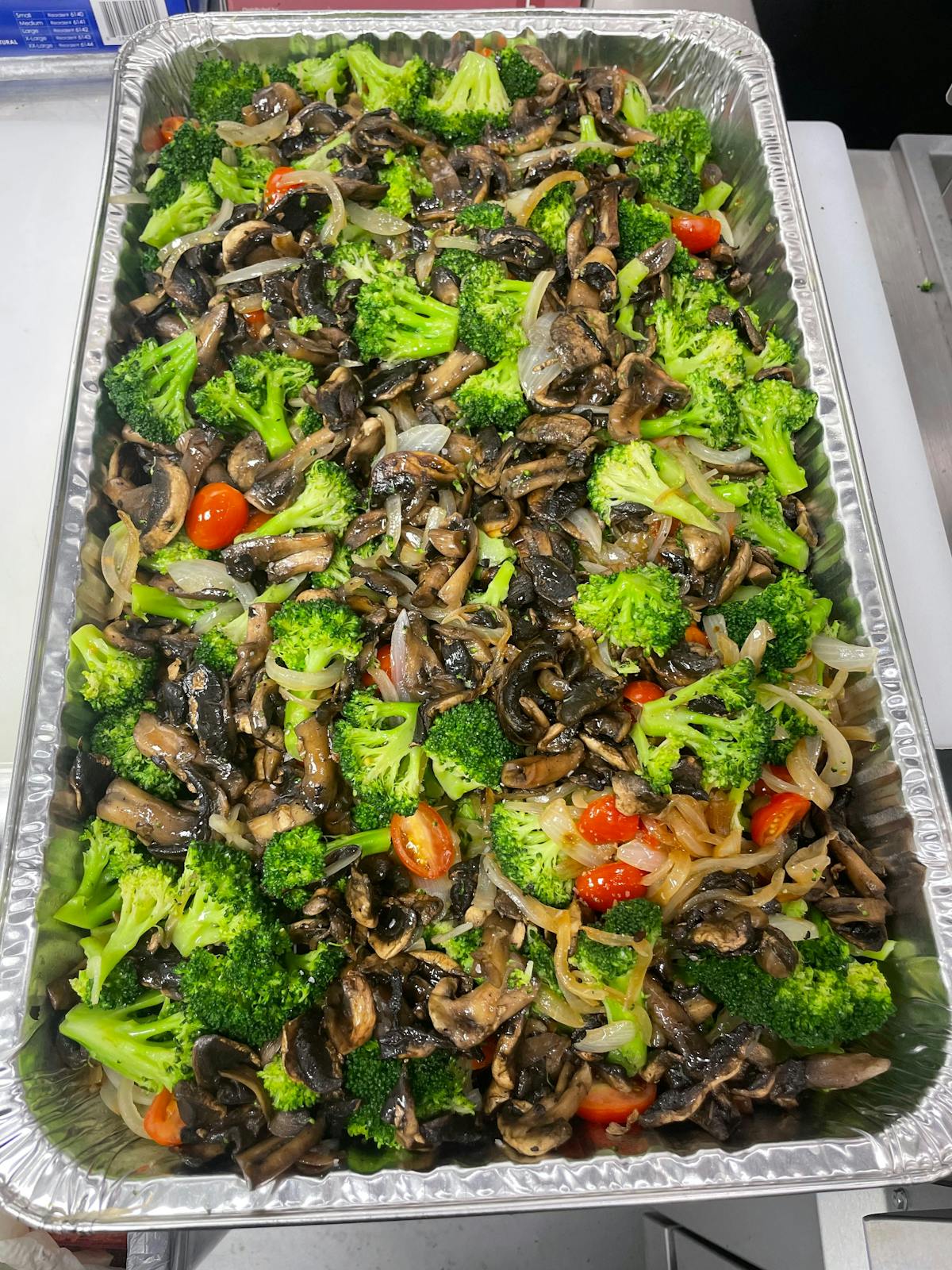 a tray of food with broccoli
