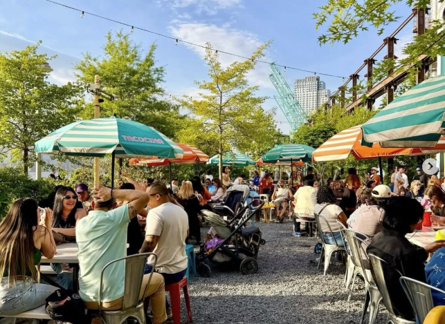 a person sitting at a table with a cup of coffee