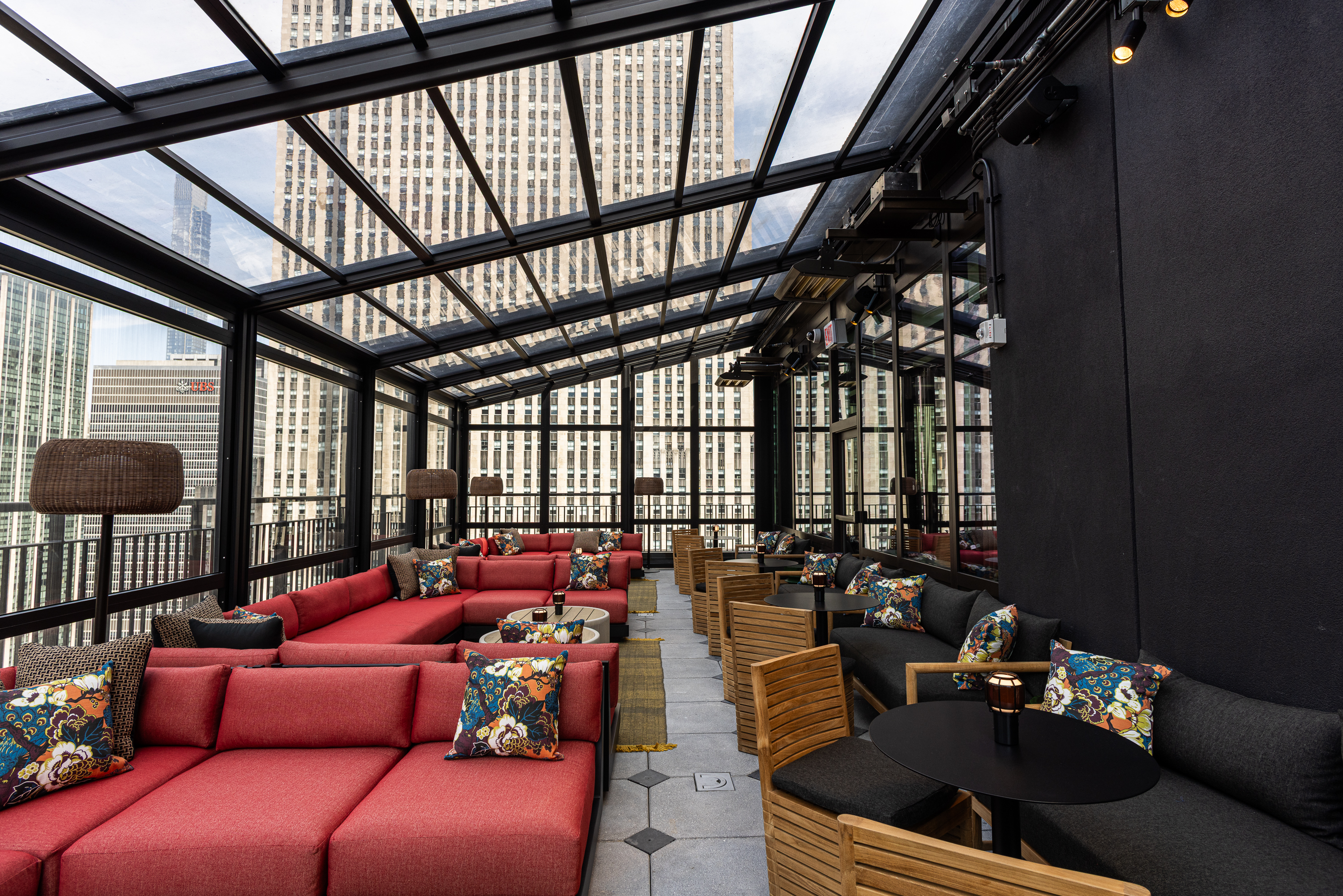 a room with a glass roof and a large window