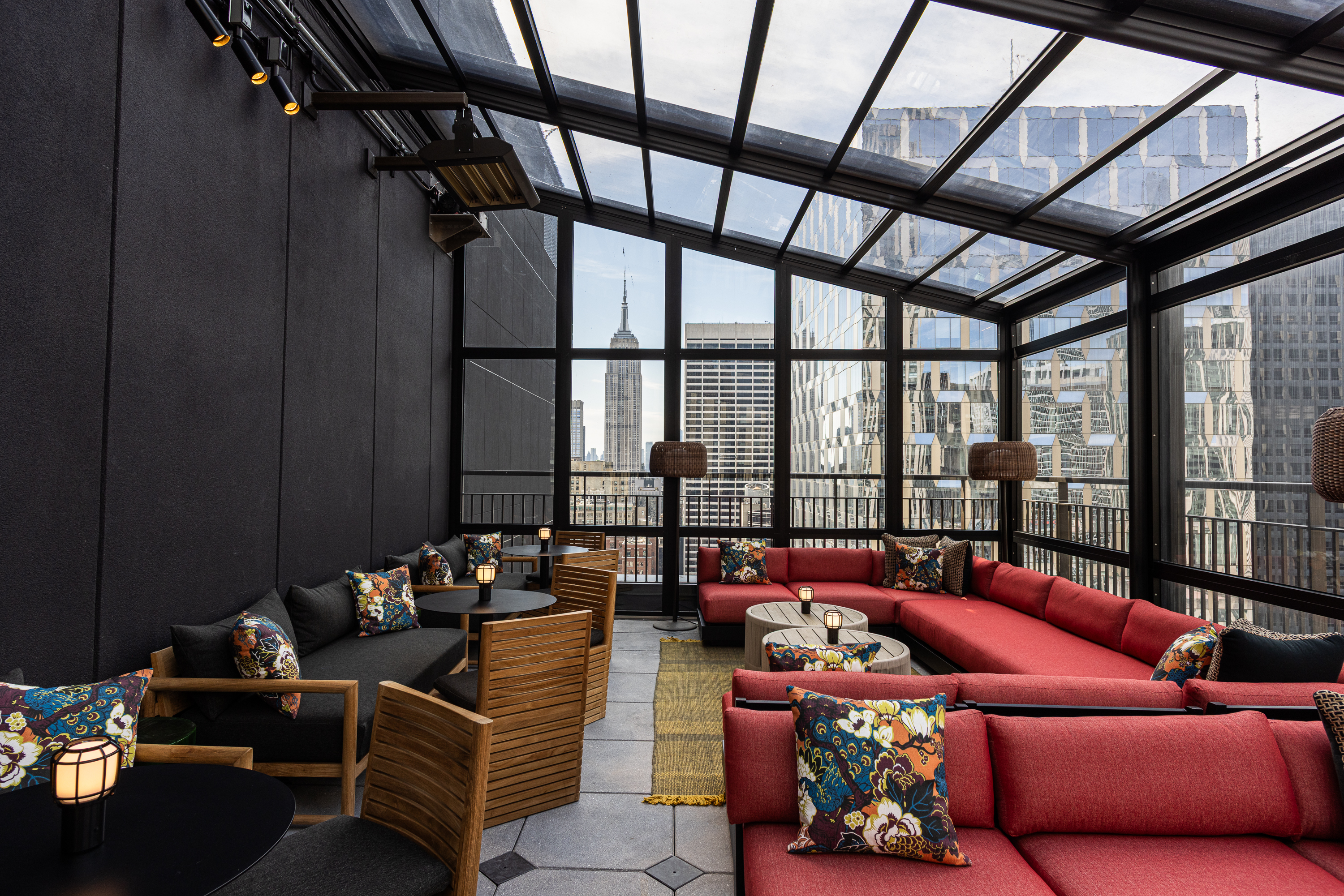 a room with a glass roof and a large window