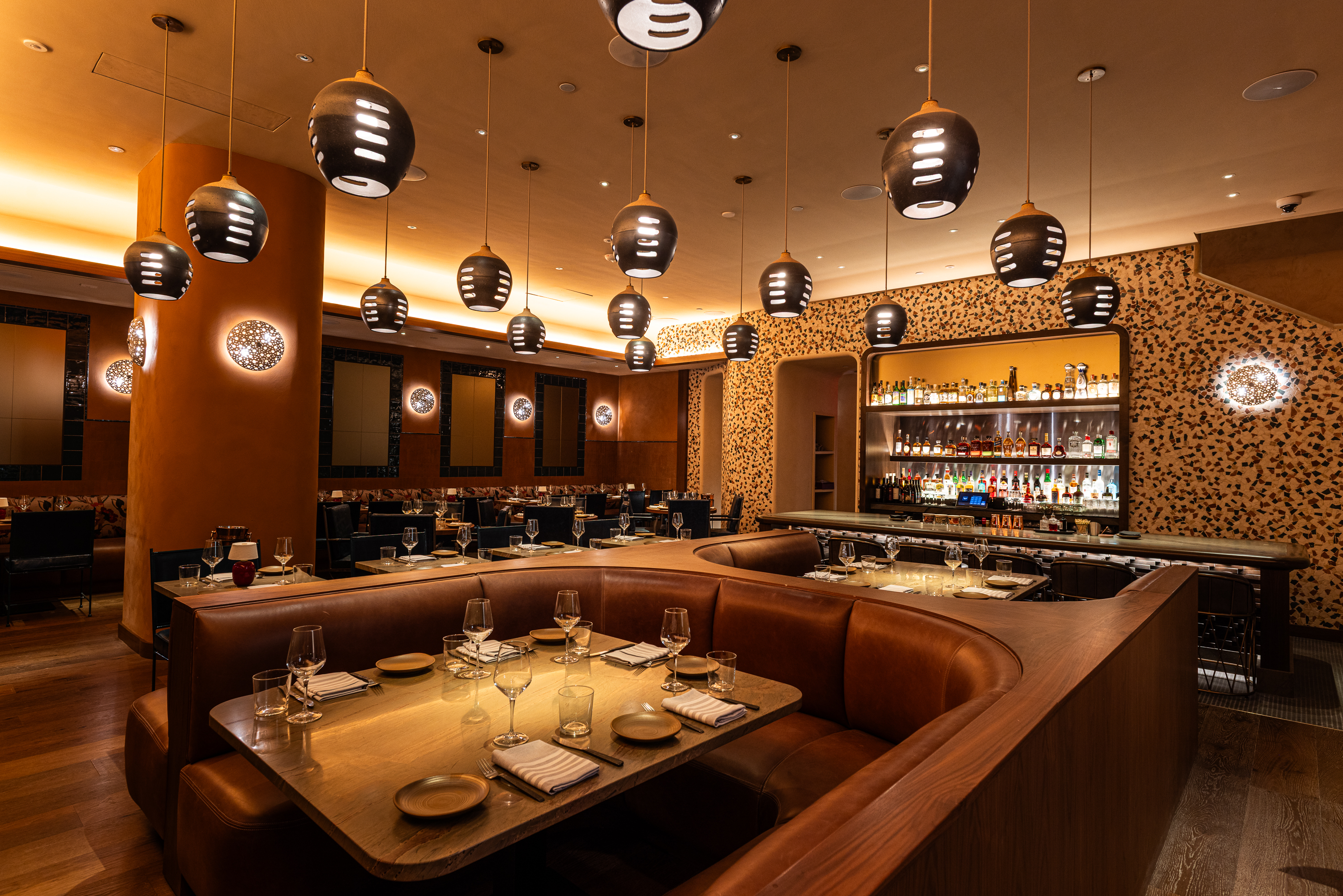 a restaurant with a booth and tables