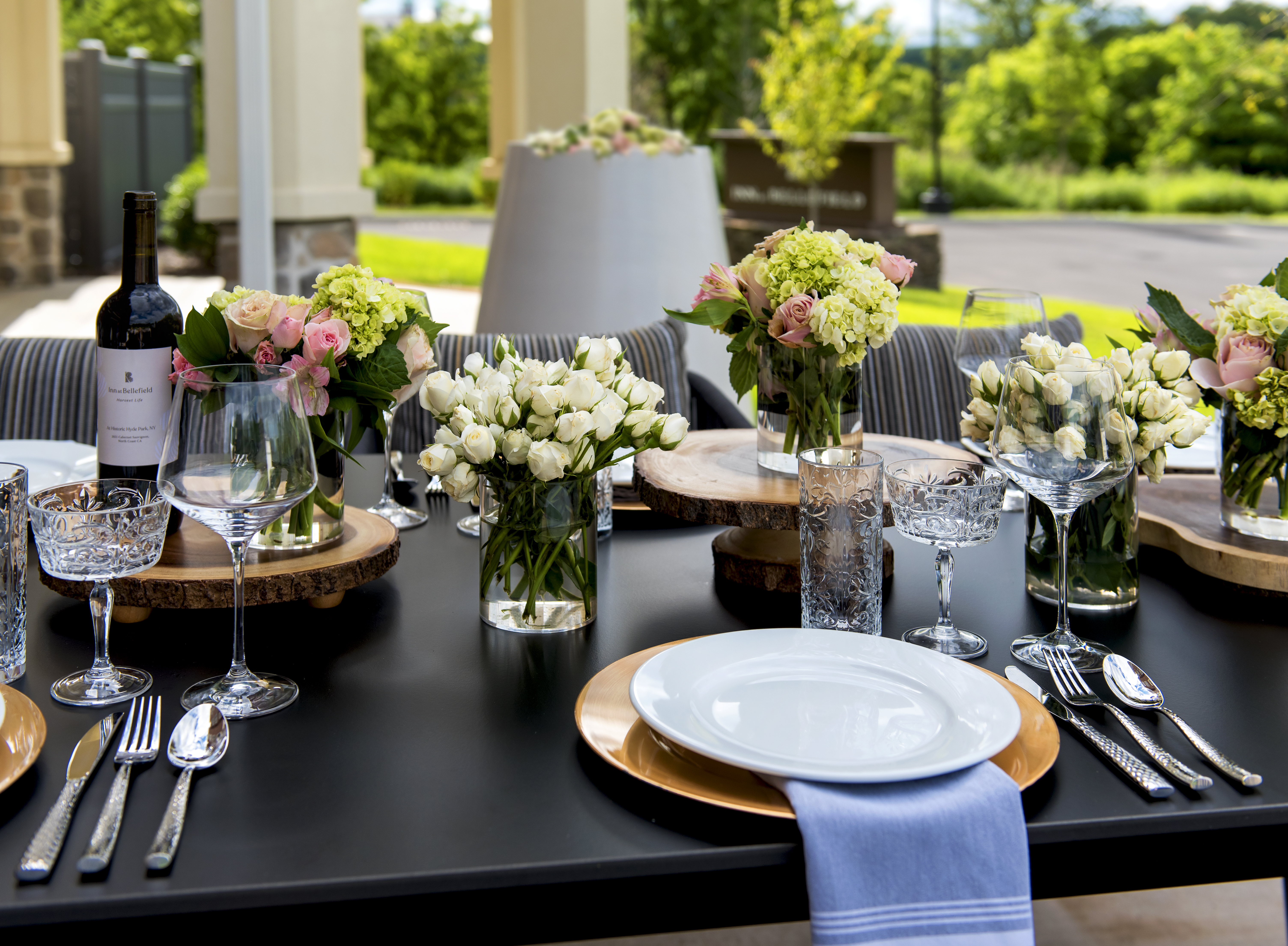 a table set with flowers and plates