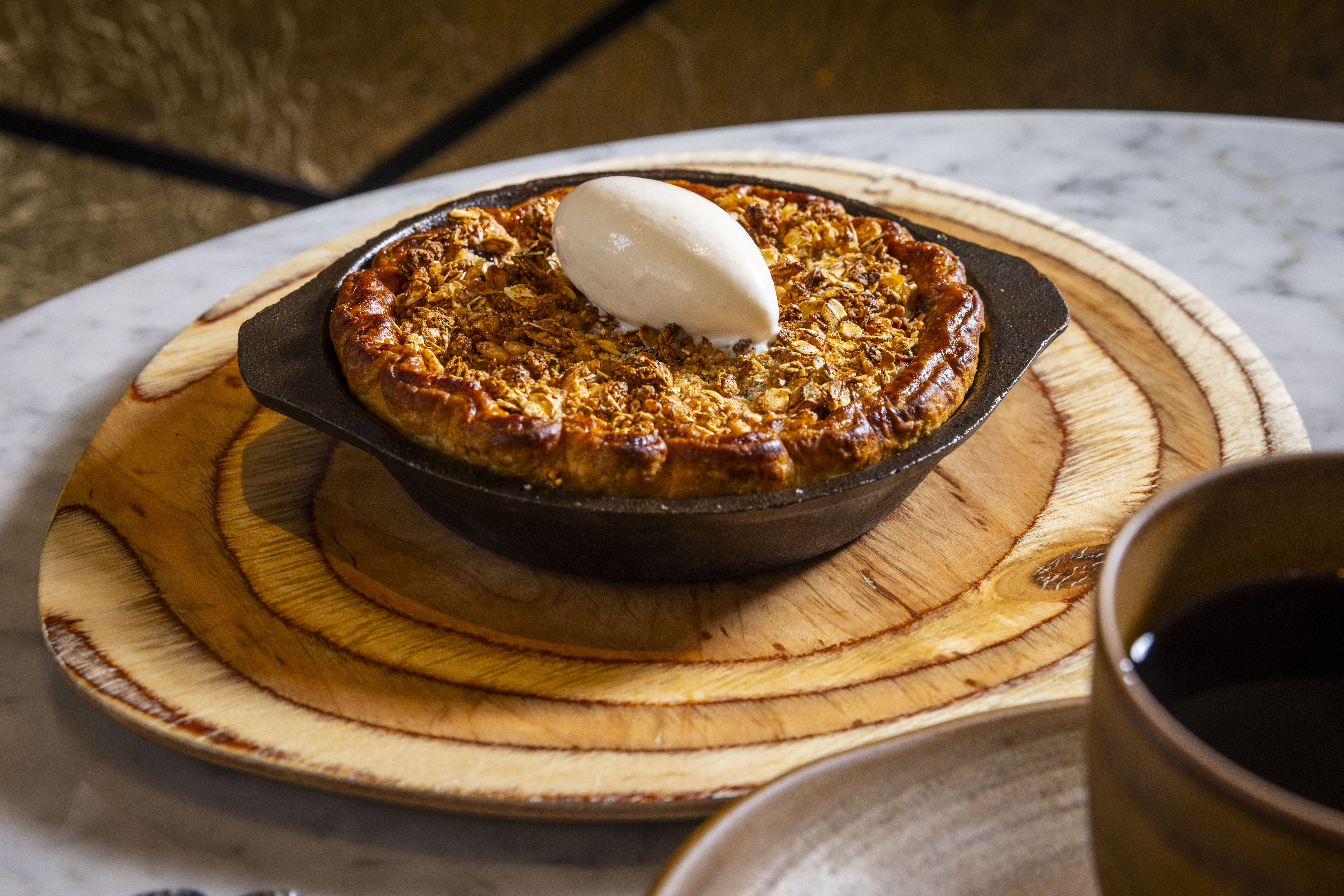 a small pie with a scoop of ice cream on top