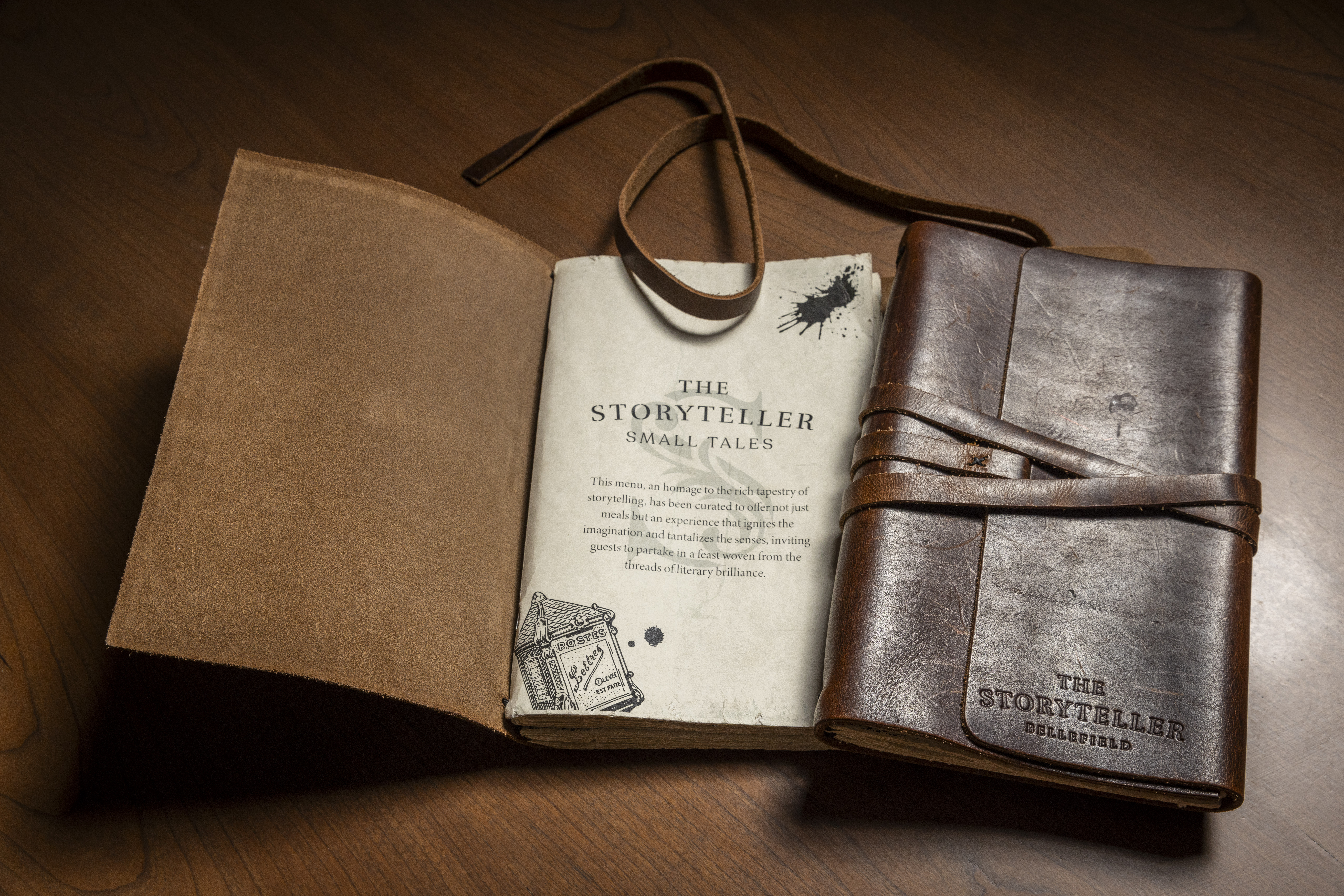 a book open with a leather strap