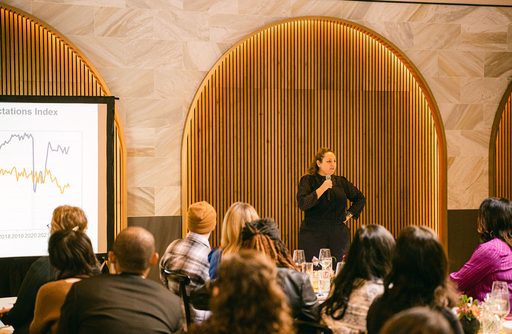 a group of people sitting in front of a crowd