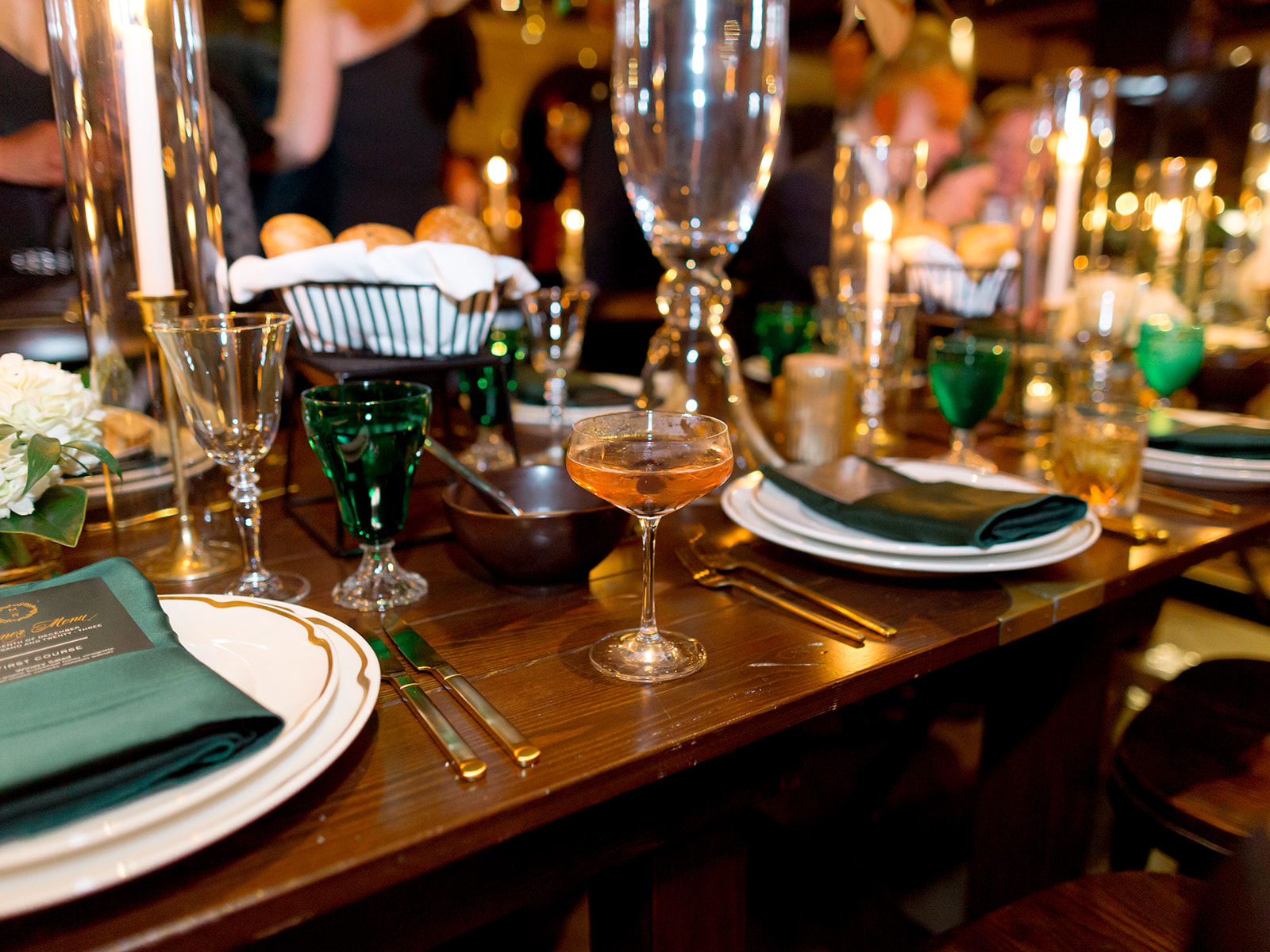 a group of people sitting at a table with wine glasses