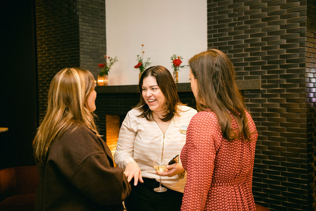 Women celebrate at a retirement party.