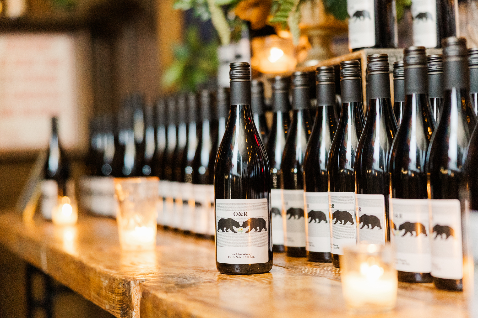 custom wine labels featuring a couple's initials and a bear