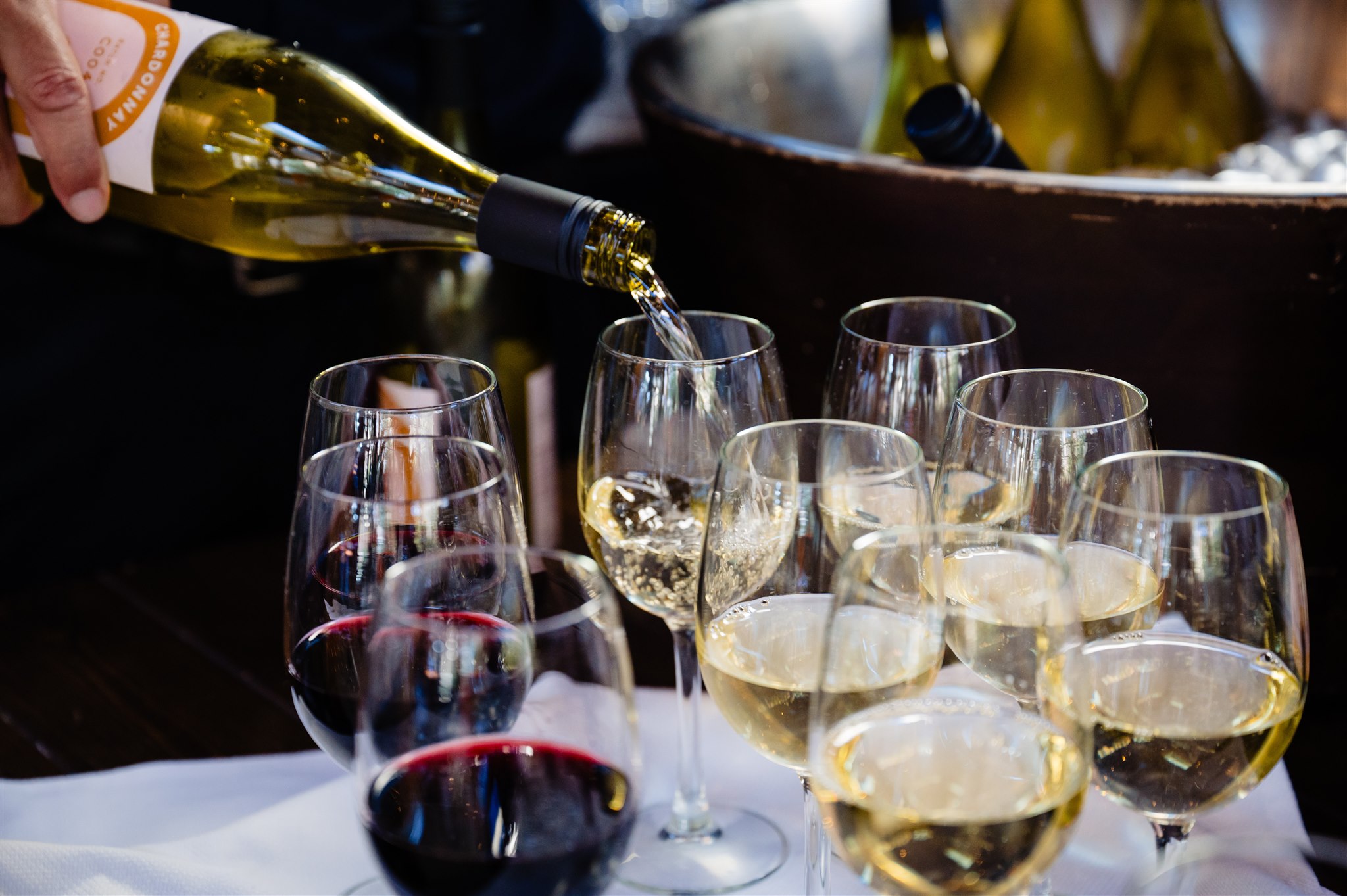 wine being poured into glasses