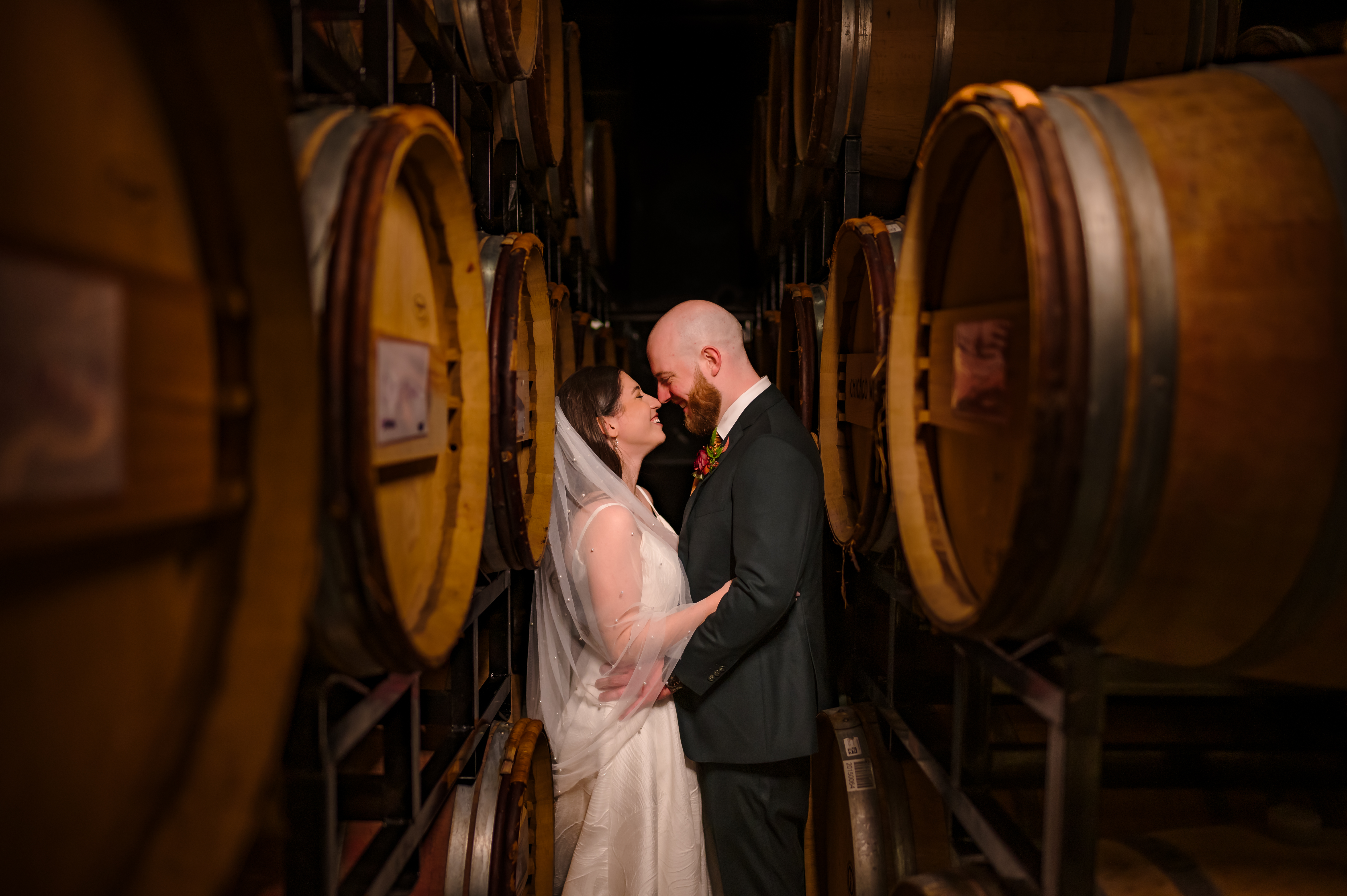 Couple among barrels at Chicago Winery