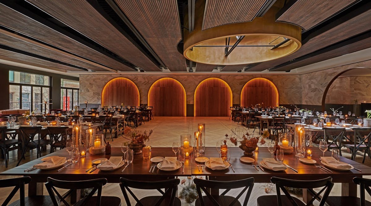 a group of people sitting at a table with wine glasses