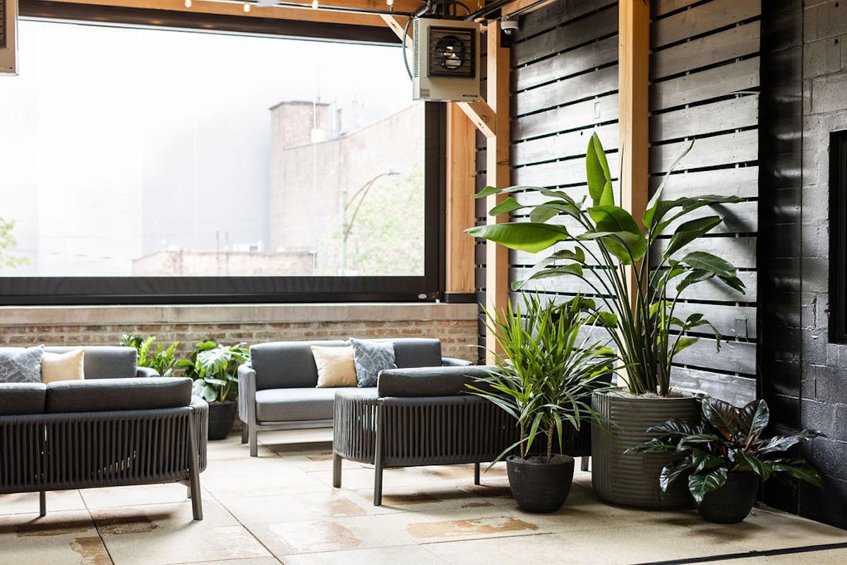 a living room filled with furniture and a large window