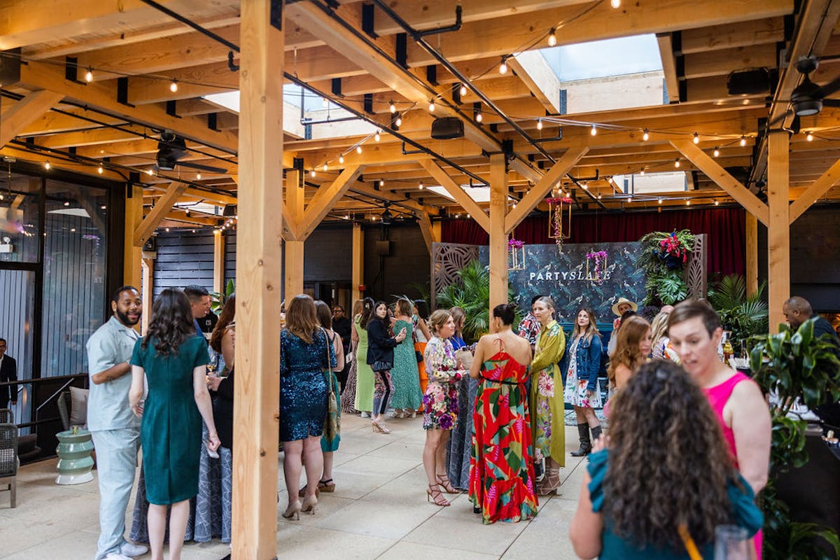 a group of people standing in front of a crowd