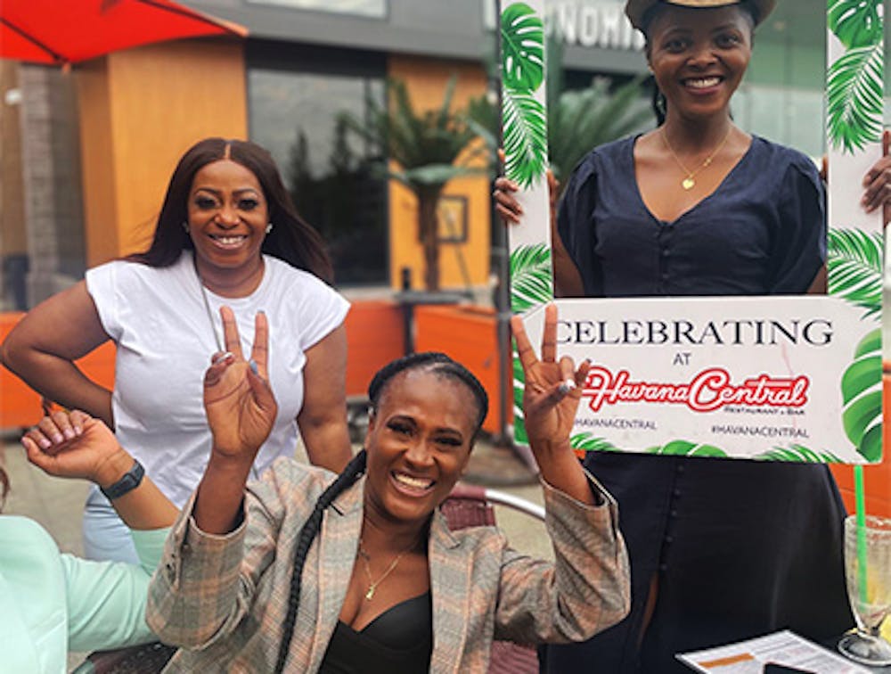 Three women celebrating at our Westbury Cuban restaurant.