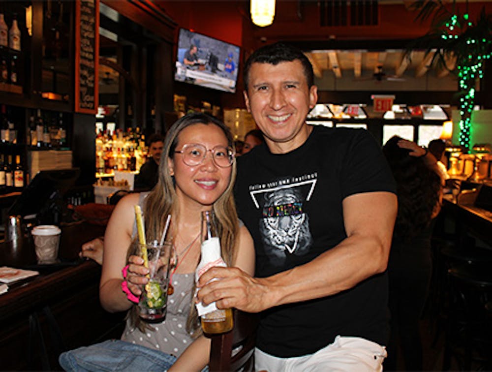 Man and woman at the bar enjoying Edison Happy Hour.